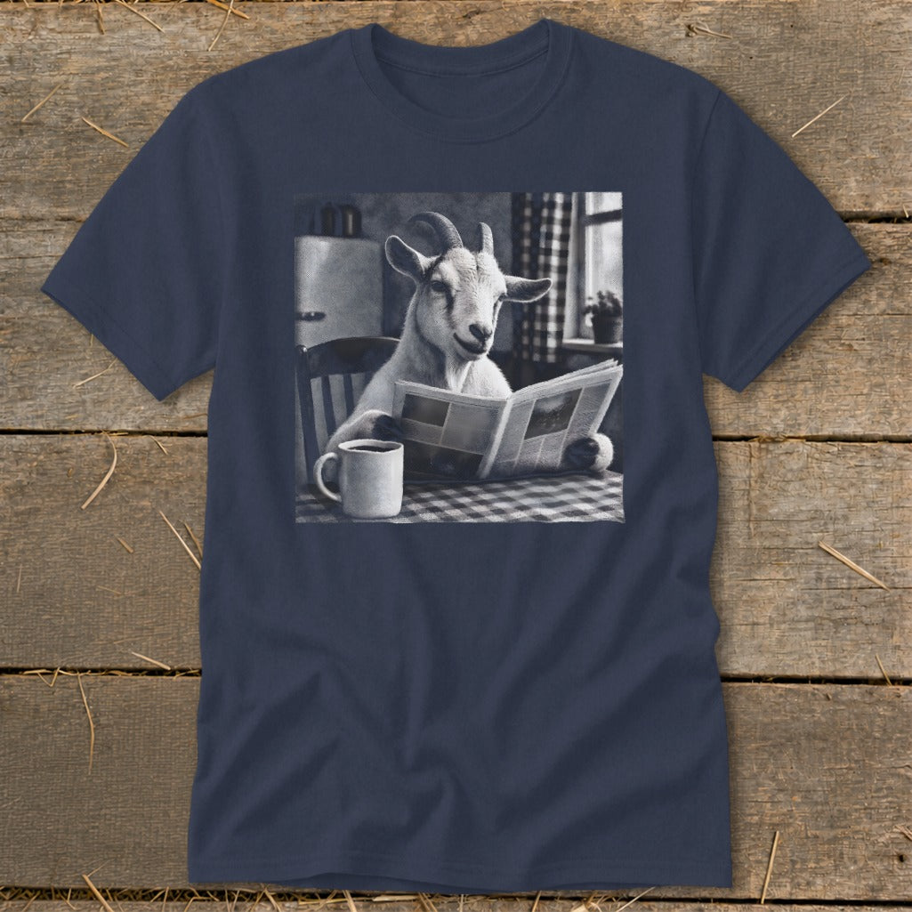 A navy blue t-shirt printed with a graphic of a goat sitting at a table, reading a newspaper next to a coffee mug.