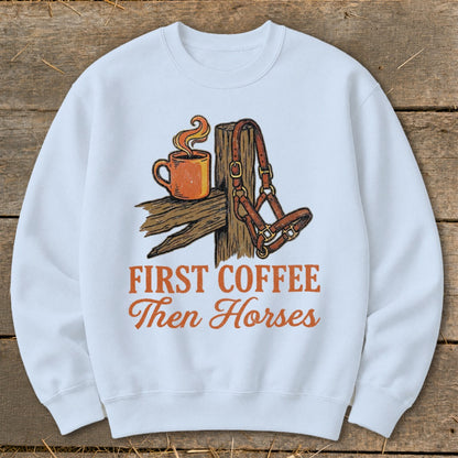 White sweatshirt with "First Coffee Then Horses" graphic featuring coffee and horse halter.