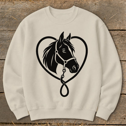 A cream-colored crewneck sweatshirt featuring a black graphic of a horse head inside a heart.
