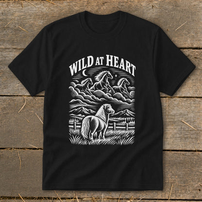 Black t-shirt with "Wild at Heart" text and horses in a landscape.
