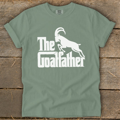 T-shirt with white text "The Goalfather" and a goat silhouette.