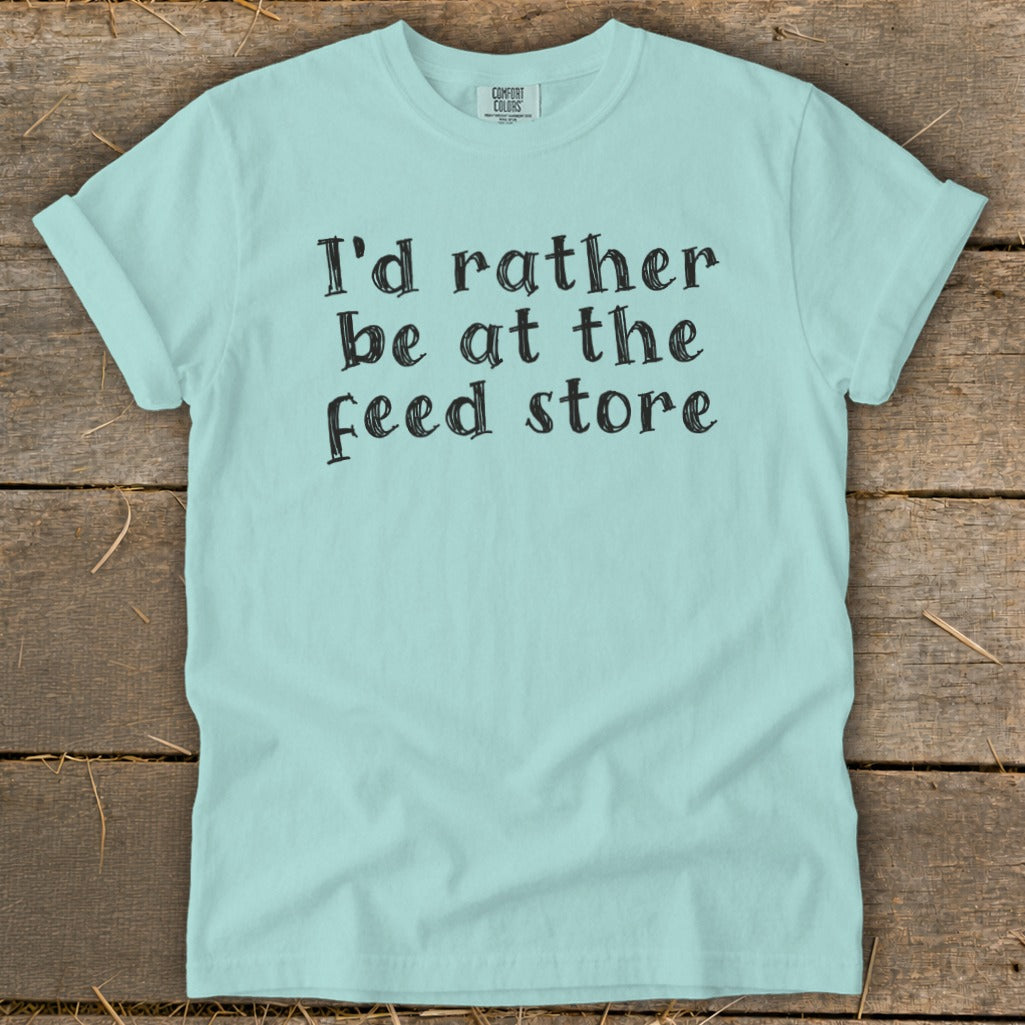 Light blue t-shirt with "I'd rather be at the feed store" text.