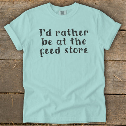 Light blue t-shirt with "I'd rather be at the feed store" text.