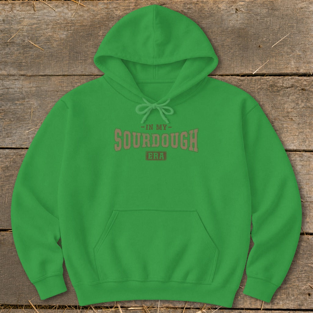 Green hoodie with "In My Sourdough Era" graphic text on the chest.