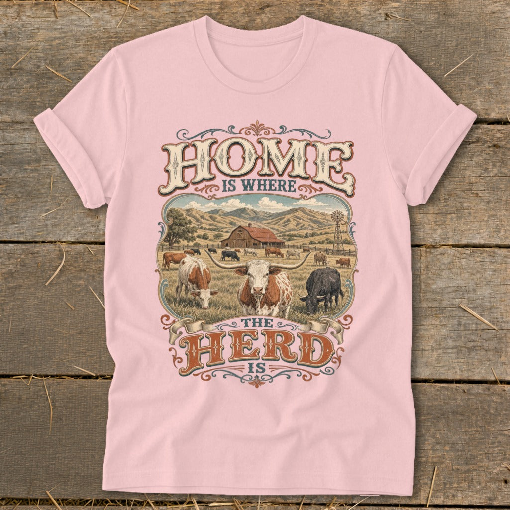Pink t-shirt with "HOME IS WHERE THE HERD IS" text and cattle farm scene.