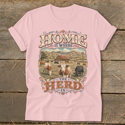 Pink t-shirt with "HOME IS WHERE THE HERD IS" text and cattle farm scene.