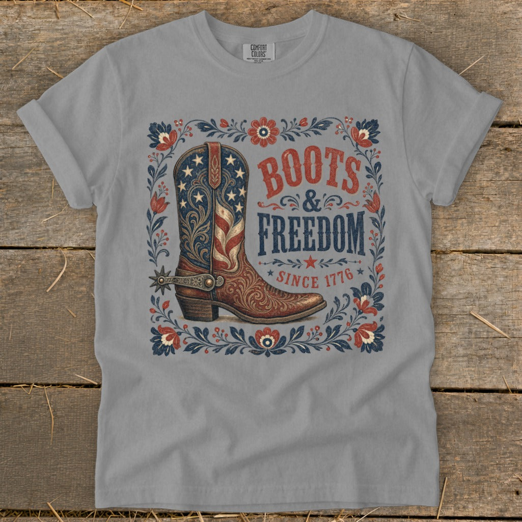 Grey t-shirt featuring a patriotic boot design with "Boots & Freedom Since 1776" text.
