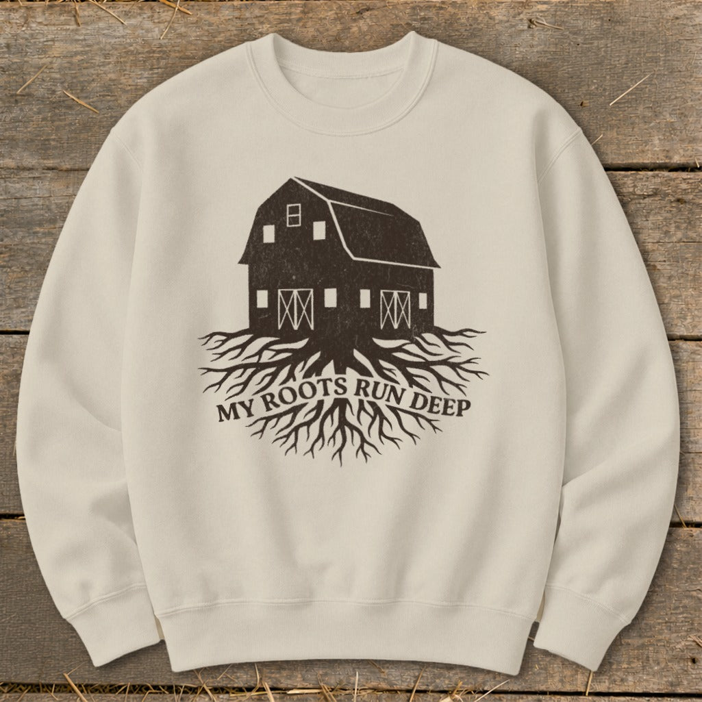Cream sweatshirt with a dark brown graphic of a barn with roots and text "My Roots Run Deep".