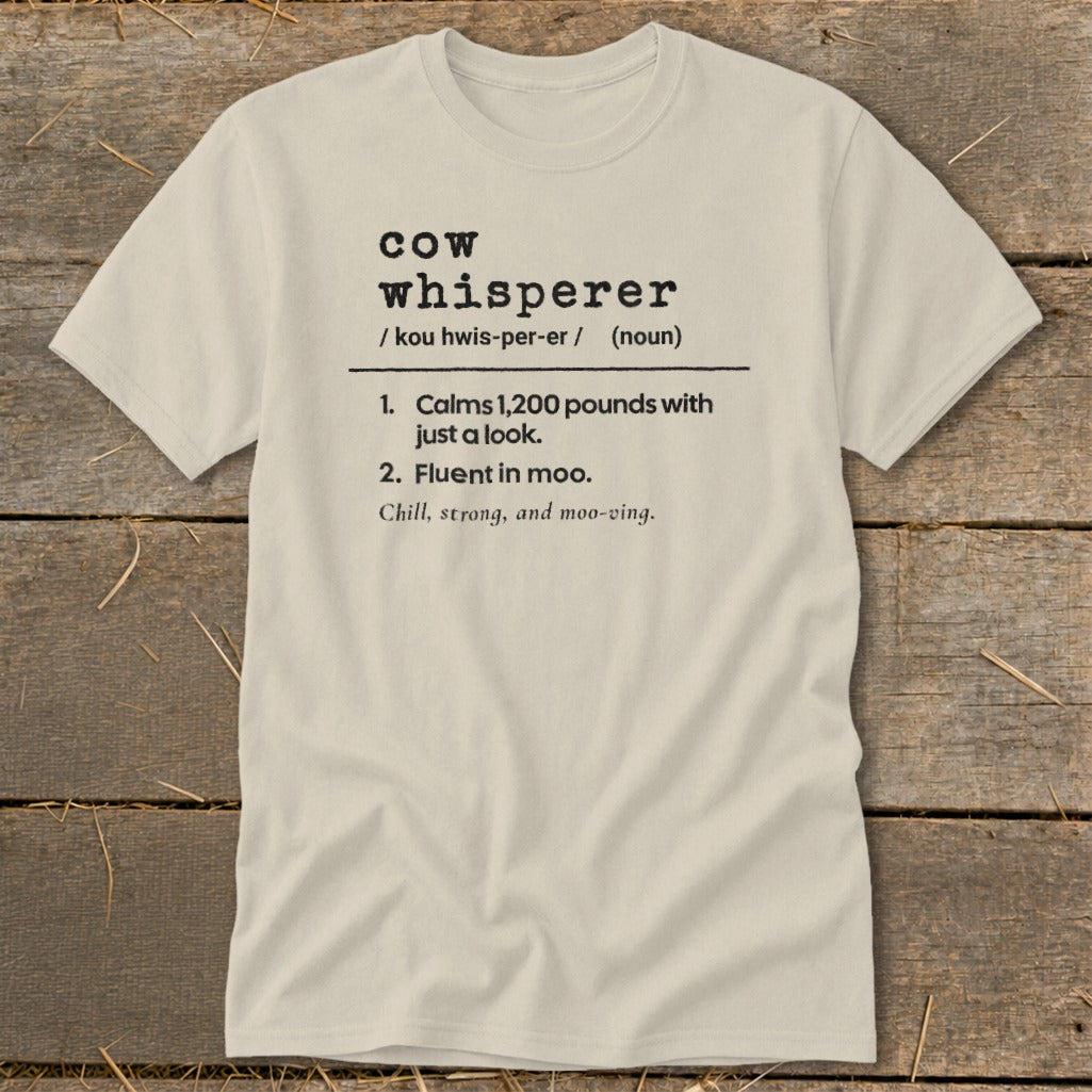 Light tan t-shirt with "Cow Whisperer" definition, including two numbered points.