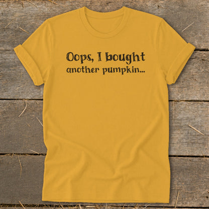 Mustard yellow t-shirt with "Oops, I bought another pumpkin..." text.