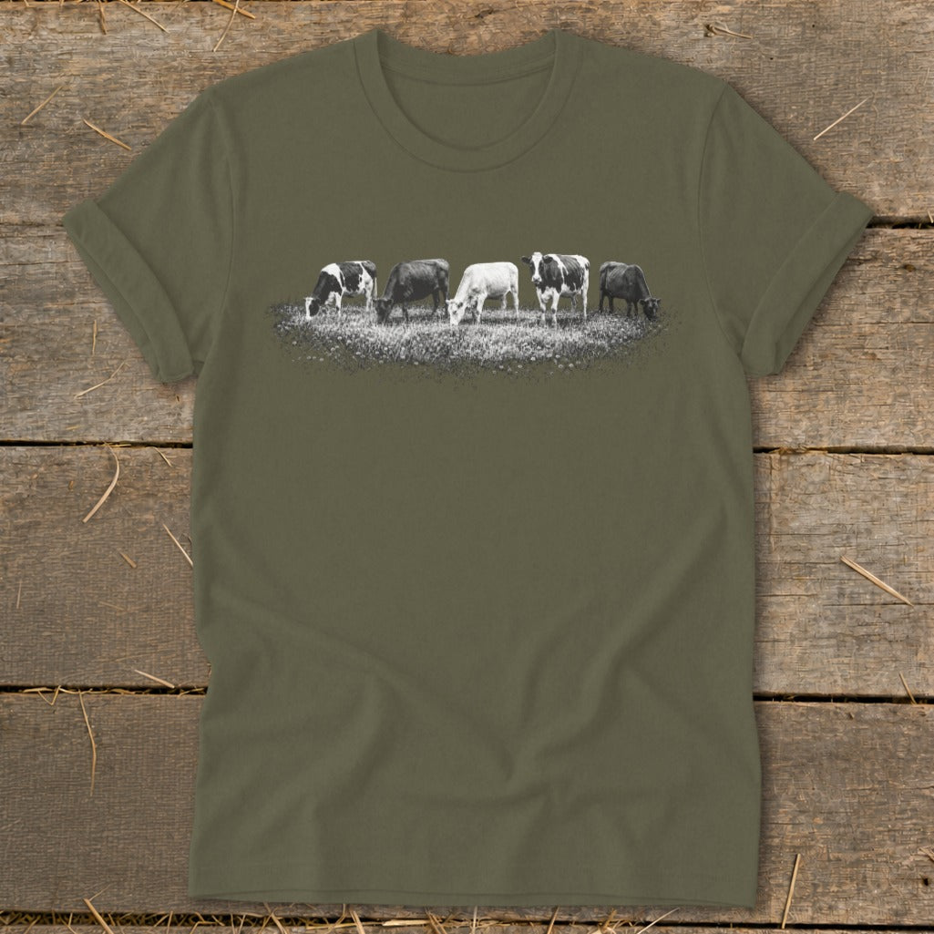 T-shirt with graphic of five cows grazing in a field.
