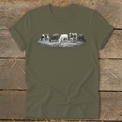 T-shirt with graphic of five cows grazing in a field.