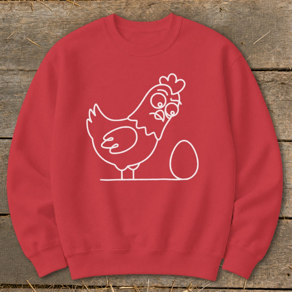 Red sweatshirt with white line drawing of a surprised chicken and an egg.