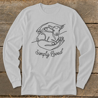 Long sleeve shirt with line art of a lamb in hands and the text "Simply Loved".