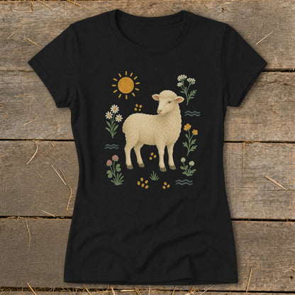 Black t-shirt with a cream sheep surrounded by flowers and a sun.