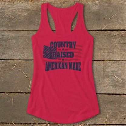Red racerback tank top with "Country Raised American Made" text and distressed American flag.