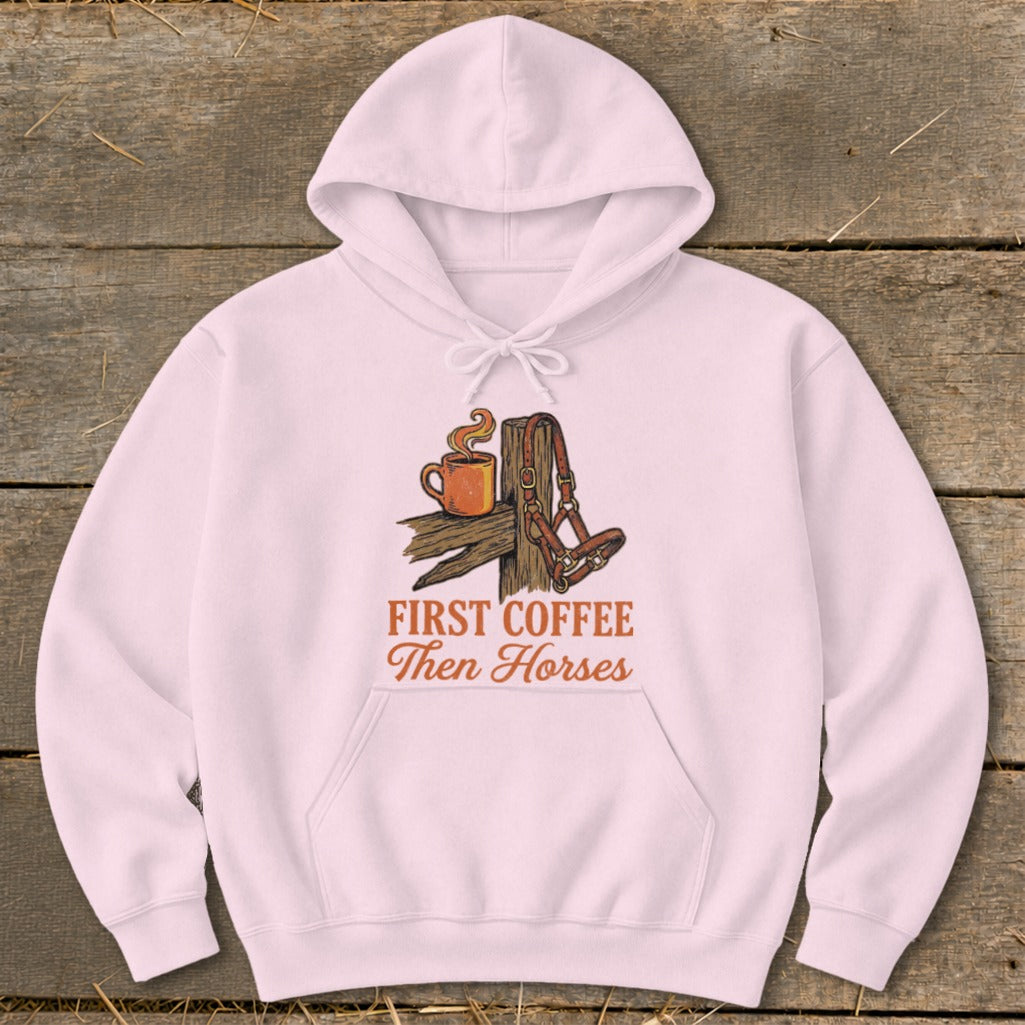 Pink hoodie with "First Coffee Then Horses" text and horse halter graphic.