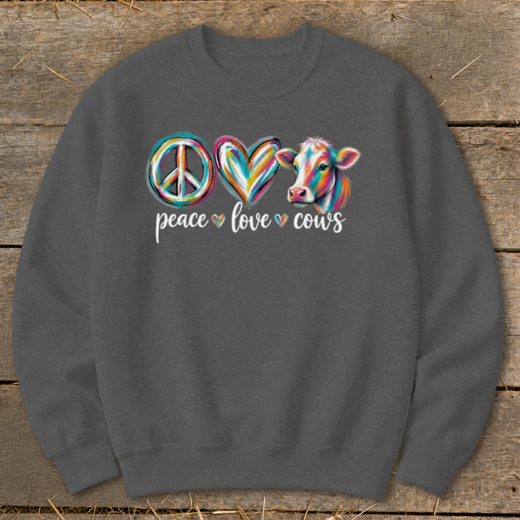 Peace, love, and cows graphic with colorful peace sign, heart, and cow.