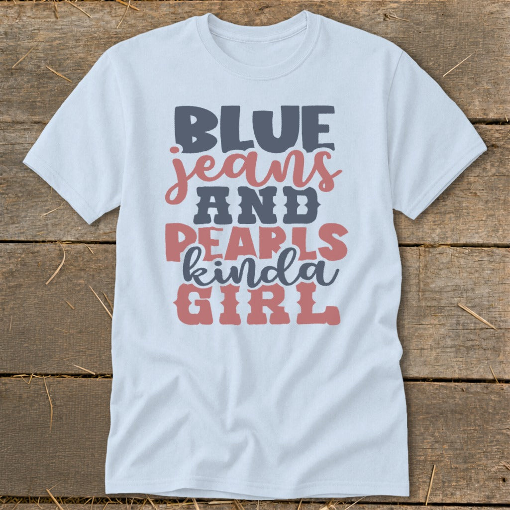 Light blue t-shirt with "BLUE jeans AND PEARLS kinda GIRL" graphic text.