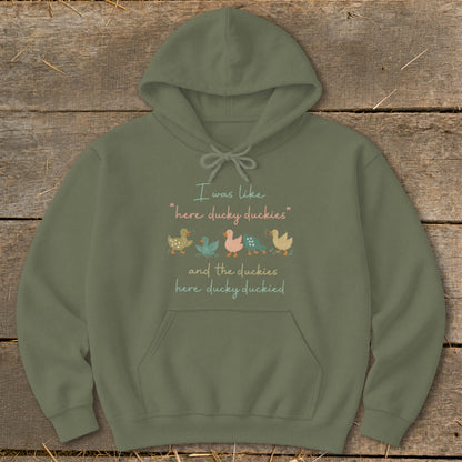Olive green hoodie with text and duck illustrations.