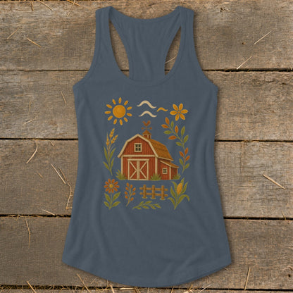 Farmhouse barn with sun, flowers, and fence design on a grey tank top.