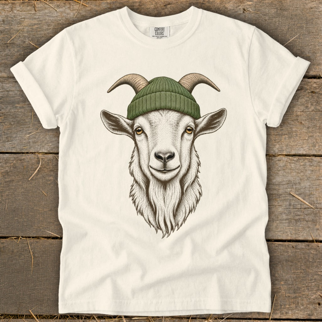 Goat with green beanie and horns on a cream t-shirt