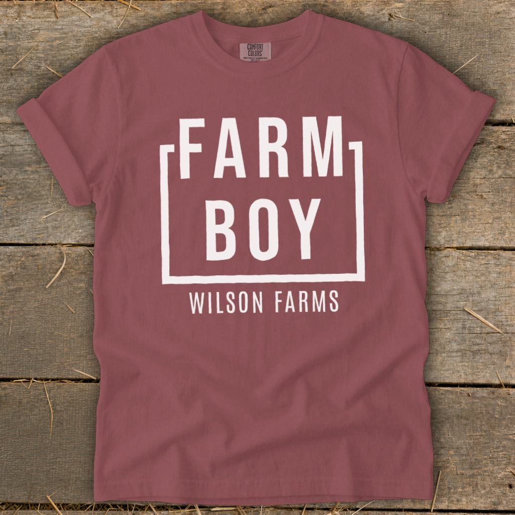 Maroon t-shirt with "FARM BOY WILSON FARMS" printed in white within a box.