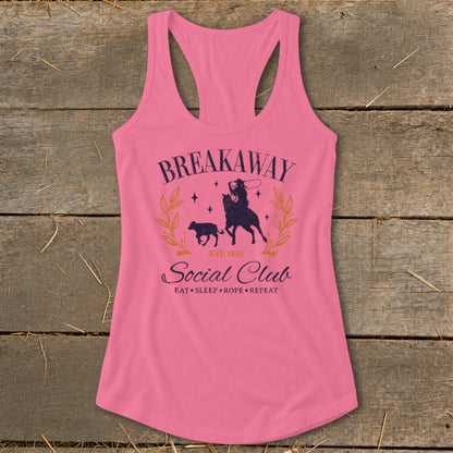 Pink tank top with "Breakaway Social Club" text and cowboy on horse with calf graphic.