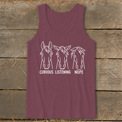 Maroon tank top featuring white line art of three horse heads with captions curious, listening, and nope.