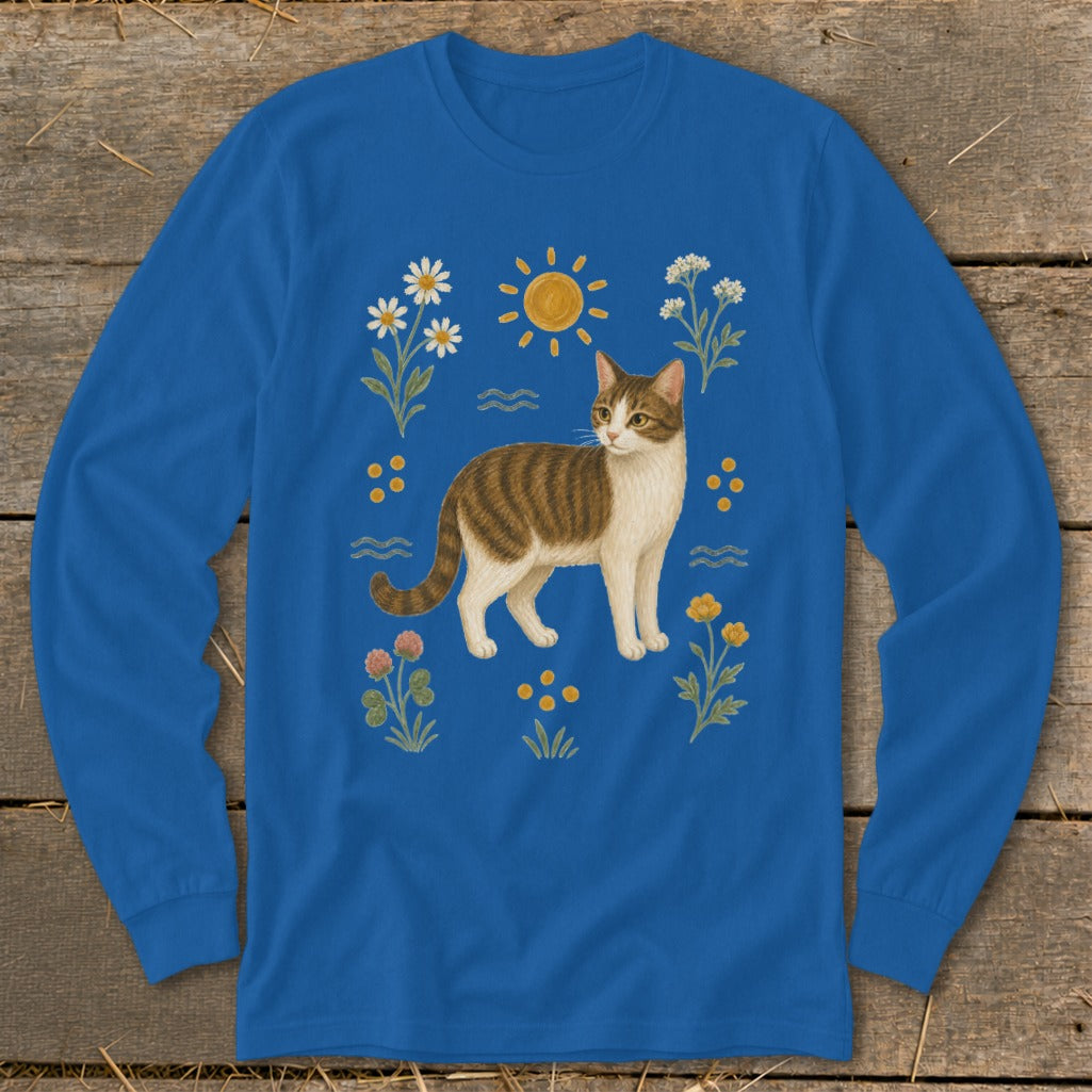 Long sleeve blue shirt with tabby cat and floral illustration.