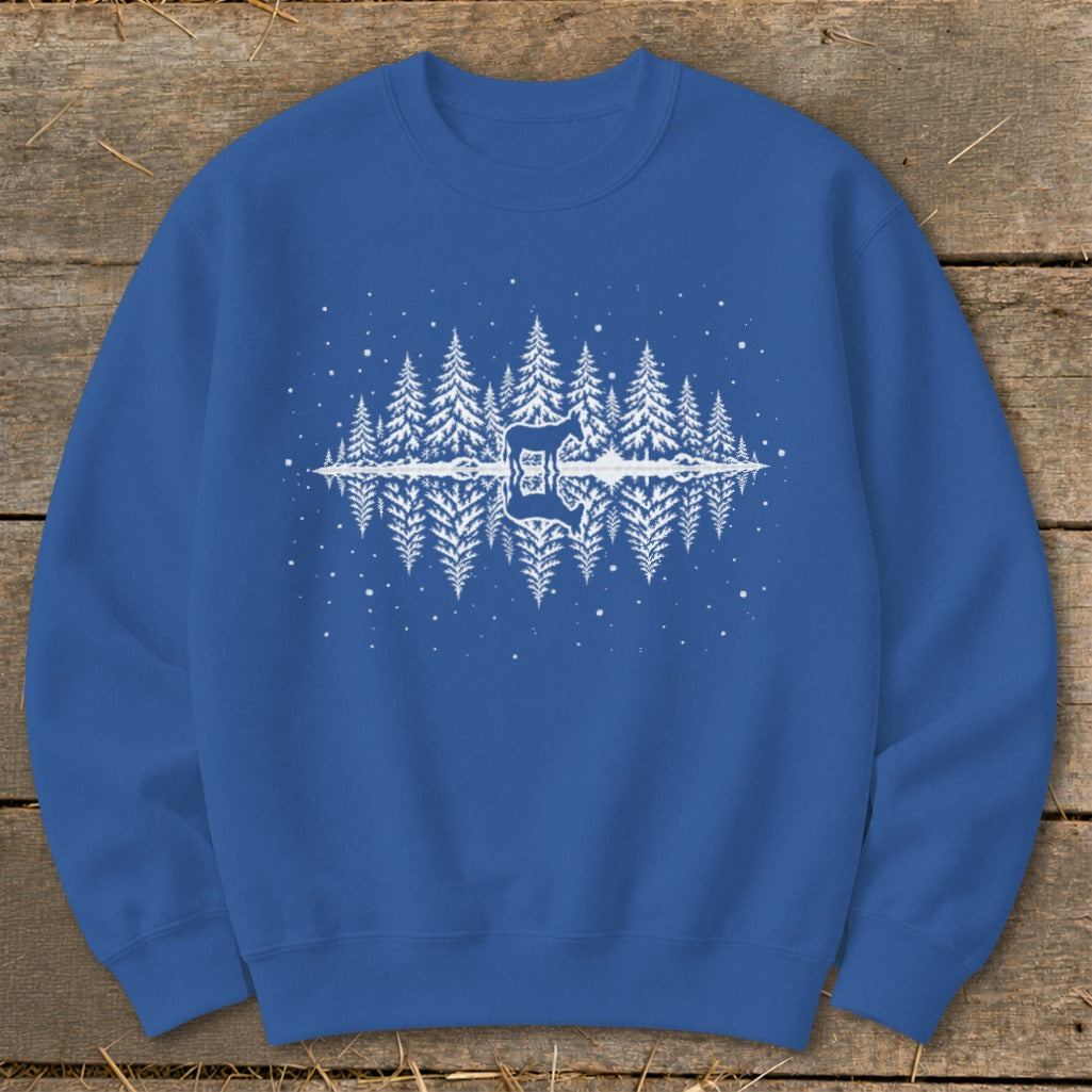 Blue sweatshirt with a white graphic of a mirrored forest and deer.