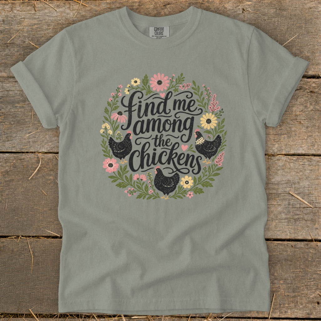 Grey t-shirt with floral wreath, chickens, and text "Find me among the chickens".