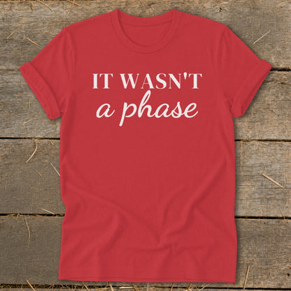 Red t-shirt with white text that reads "IT WASN'T a phase".