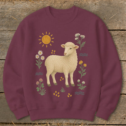 Maroon sweatshirt with a cream sheep and floral illustration, sun, and wavy lines.