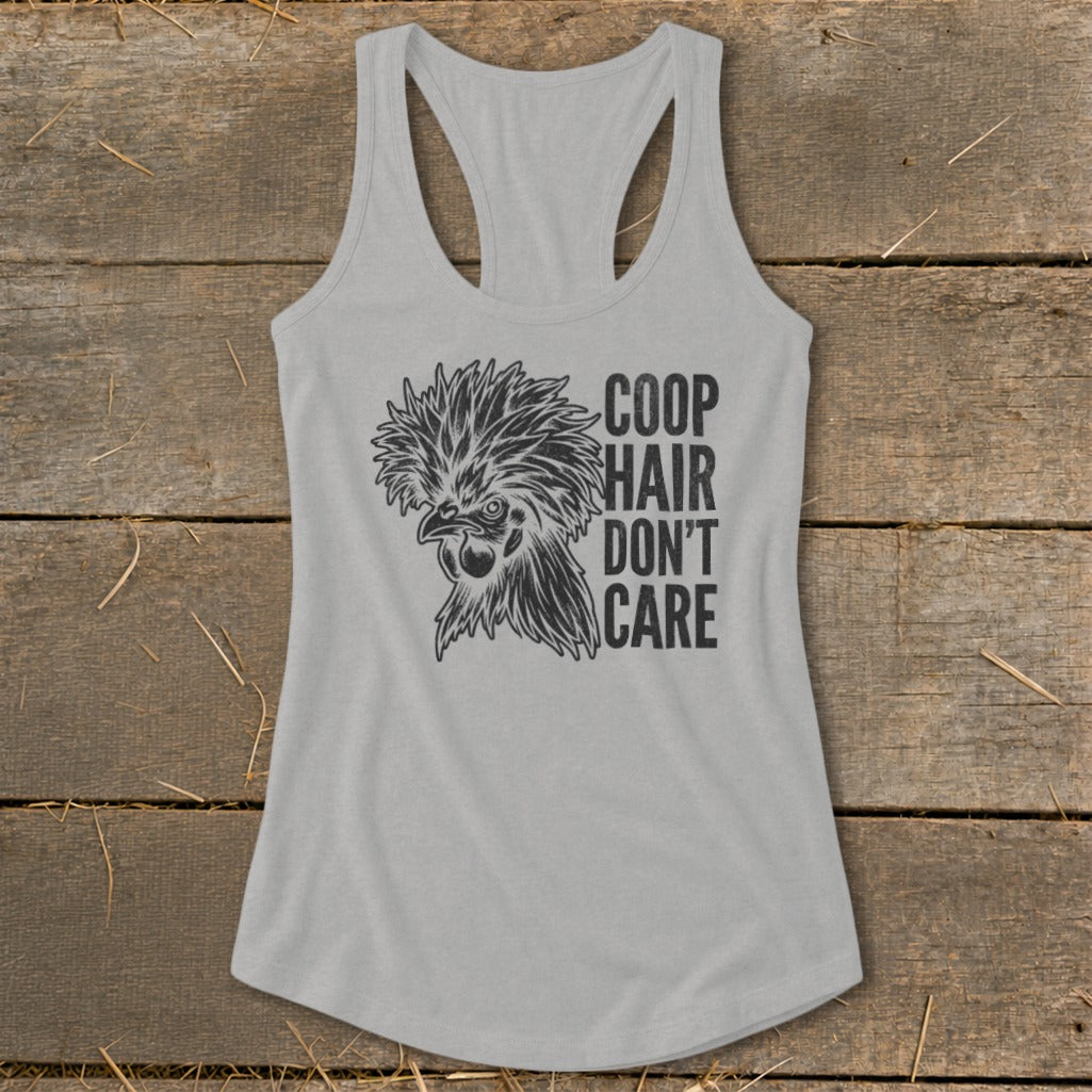Grey racerback tank top with a stylized chicken graphic and text "COOP HAIR DON'T CARE".