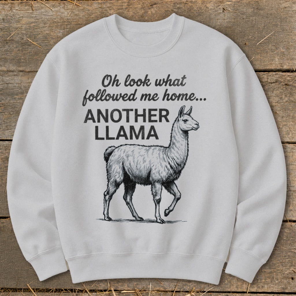 White sweatshirt with sketch of llama and text "Oh look what followed me home... ANOTHER LLAMA".