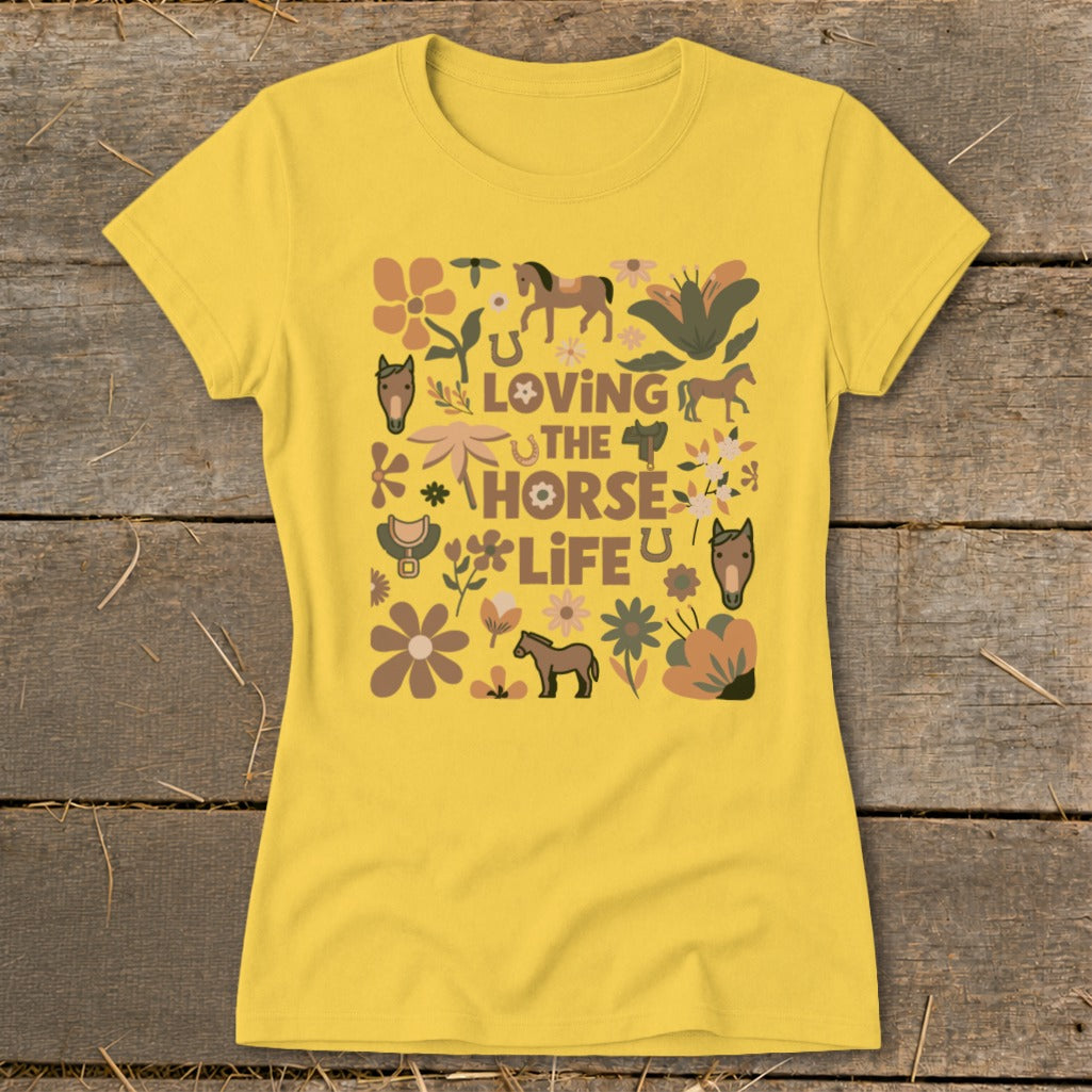 Yellow t-shirt with "Loving the Horse Life" graphic featuring horses and floral designs.
