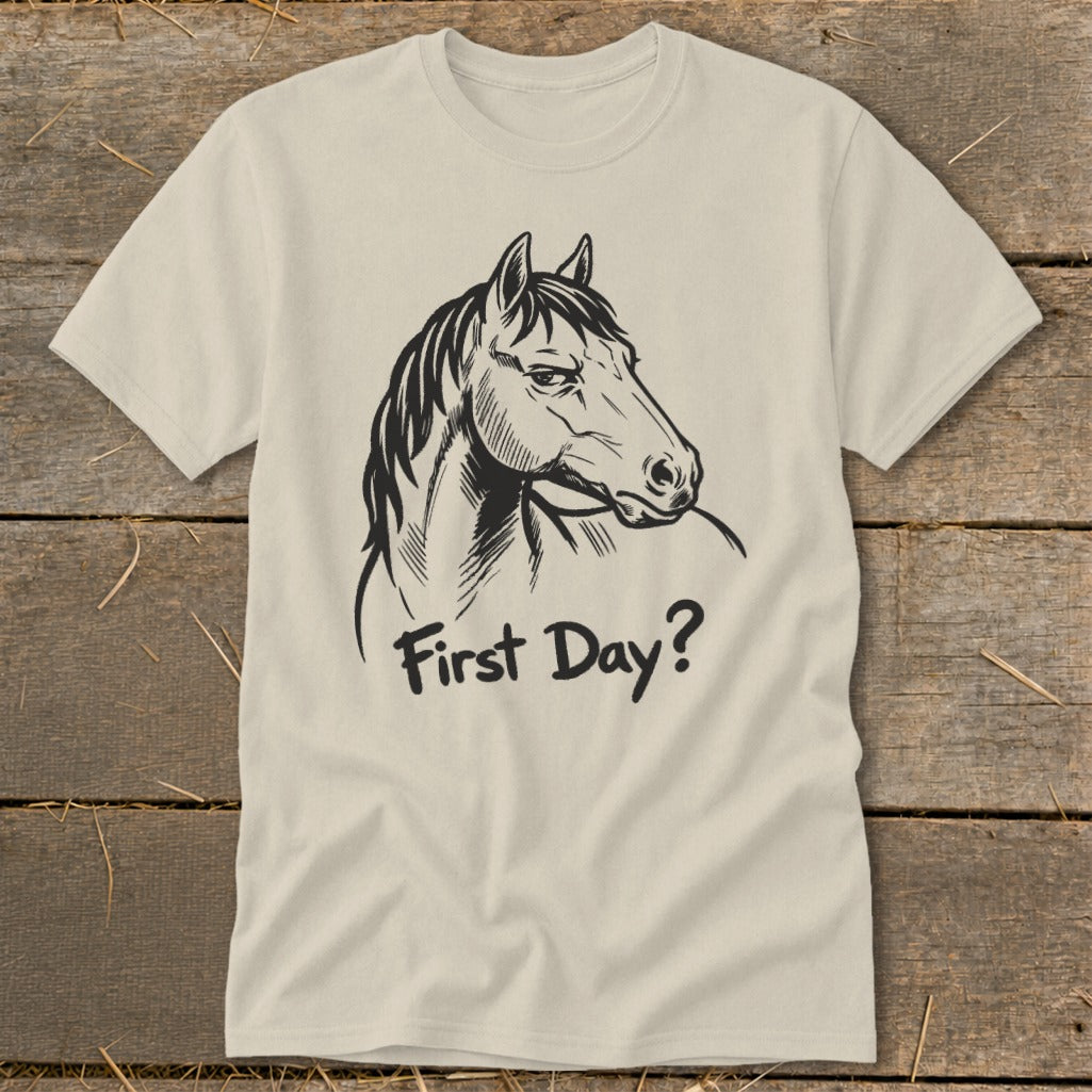 Light brown t-shirt with black drawing of a horse's head and text "First Day?".