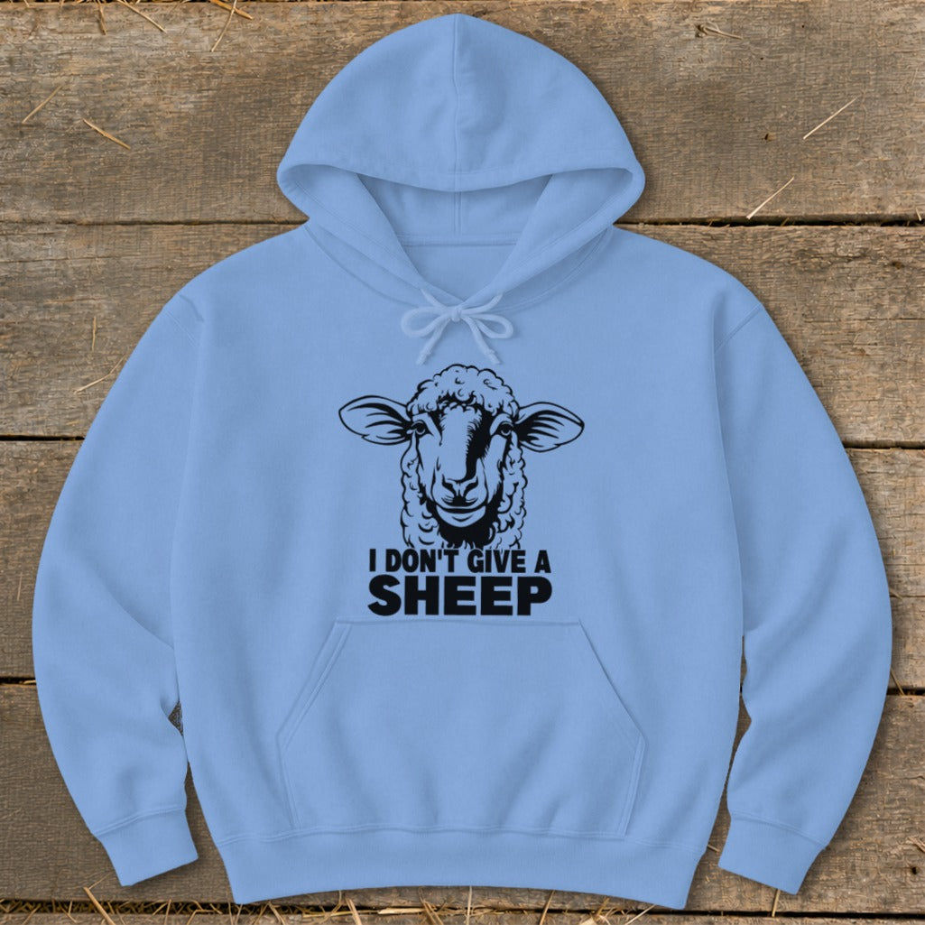 Light blue hoodie with black sheep graphic and "I DON'T GIVE A SHEEP" text.