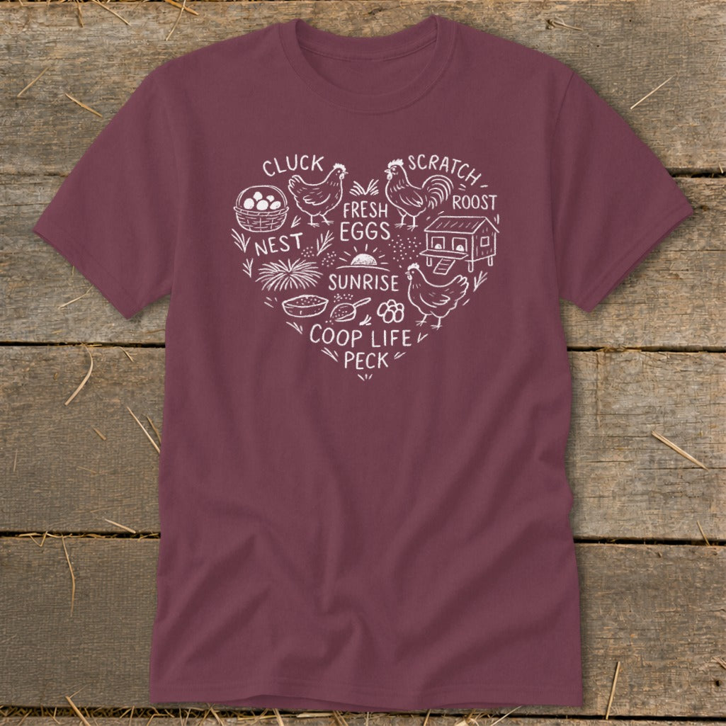 Maroon t-shirt with white heart-shaped chicken coop life graphic and text.