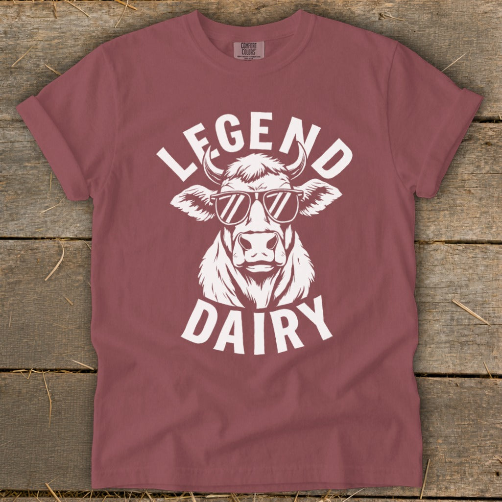 T-shirt with white graphic of a cow wearing sunglasses and text "LEGEND DAIRY".