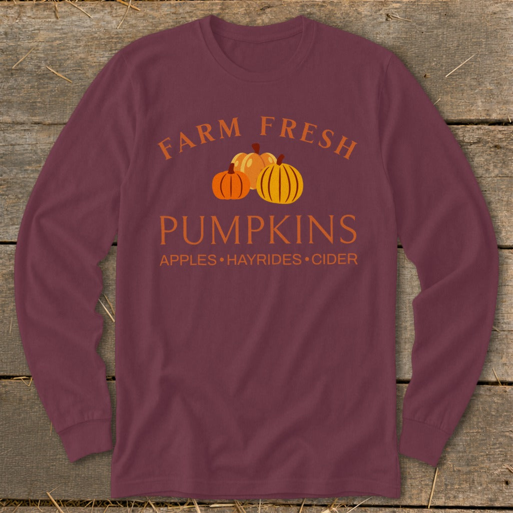 Burgundy long sleeve shirt with "Farm Fresh Pumpkins" and "Apples • Hayrides • Cider" text.