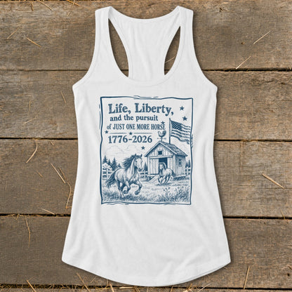 White tank top with "Life, Liberty, and the pursuit of JUST ONE MORE HORSE 1776-2026" graphic.