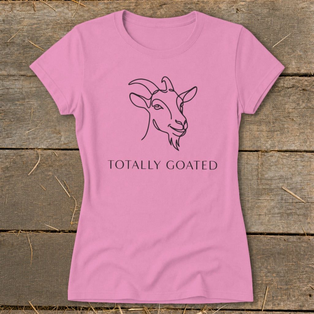 Pink t-shirt with a black line drawing of a goat and the text "TOTALLY GOATED".