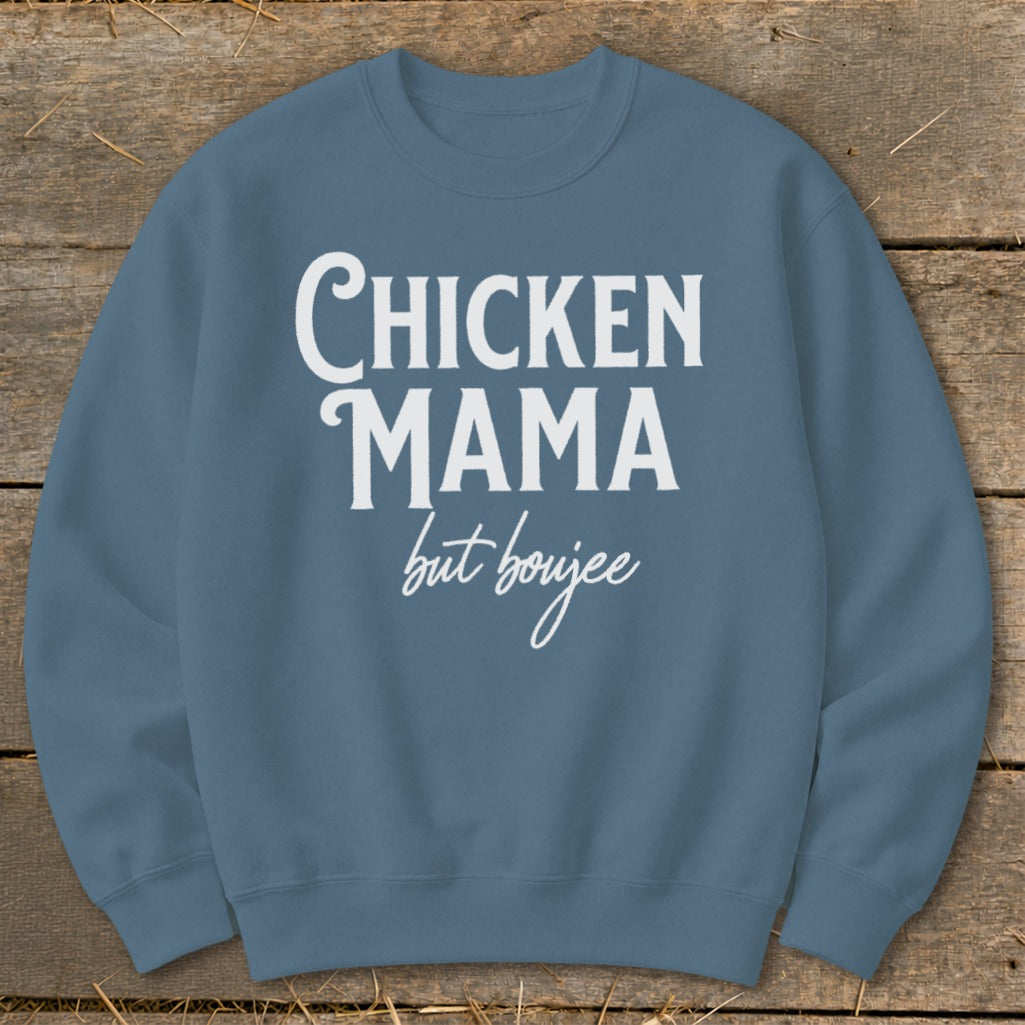 Blue sweatshirt with white text that reads "Chicken Mama but boujee."