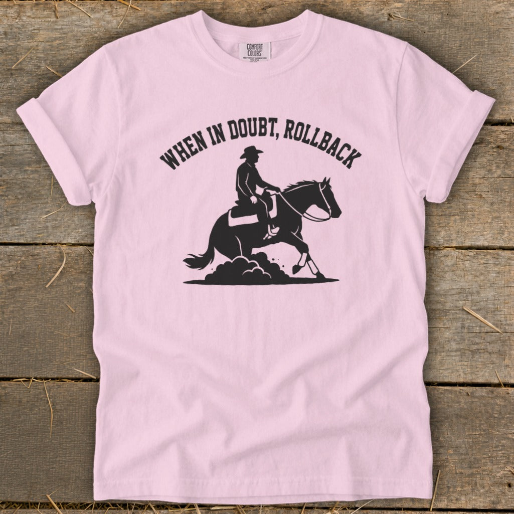 Pink t-shirt with black graphic of a rider on a horse doing a rollback, text "WHEN IN DOUBT, ROLLBACK".