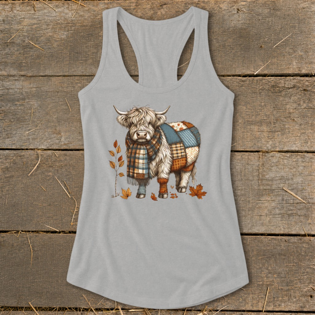 Highland cow graphic with plaid scarf and patchwork quilt on gray tank top.