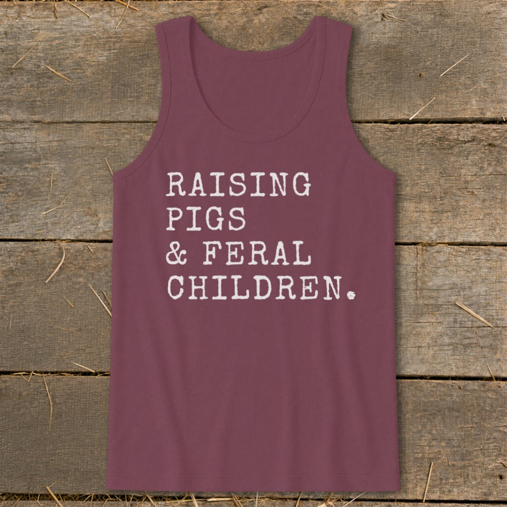 Maroon tank top with white text reading "RAISING PIGS & FERAL CHILDREN."