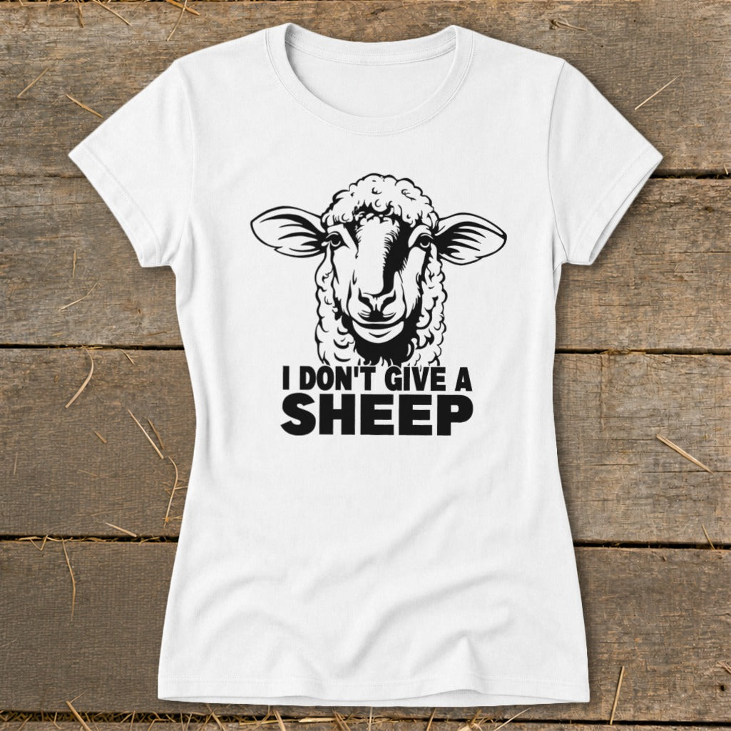 White t-shirt with black graphic of a sheep and text "I DON'T GIVE A SHEEP".
