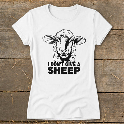 White t-shirt with black graphic of a sheep and text "I DON'T GIVE A SHEEP".